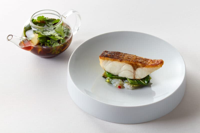 exotic food with herb and sauce container