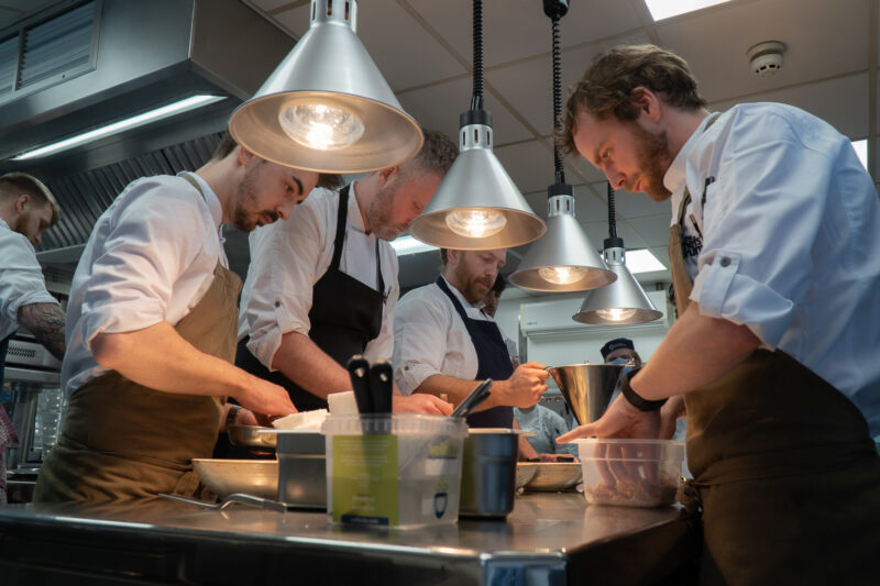 chefs cooking in the kitchen together