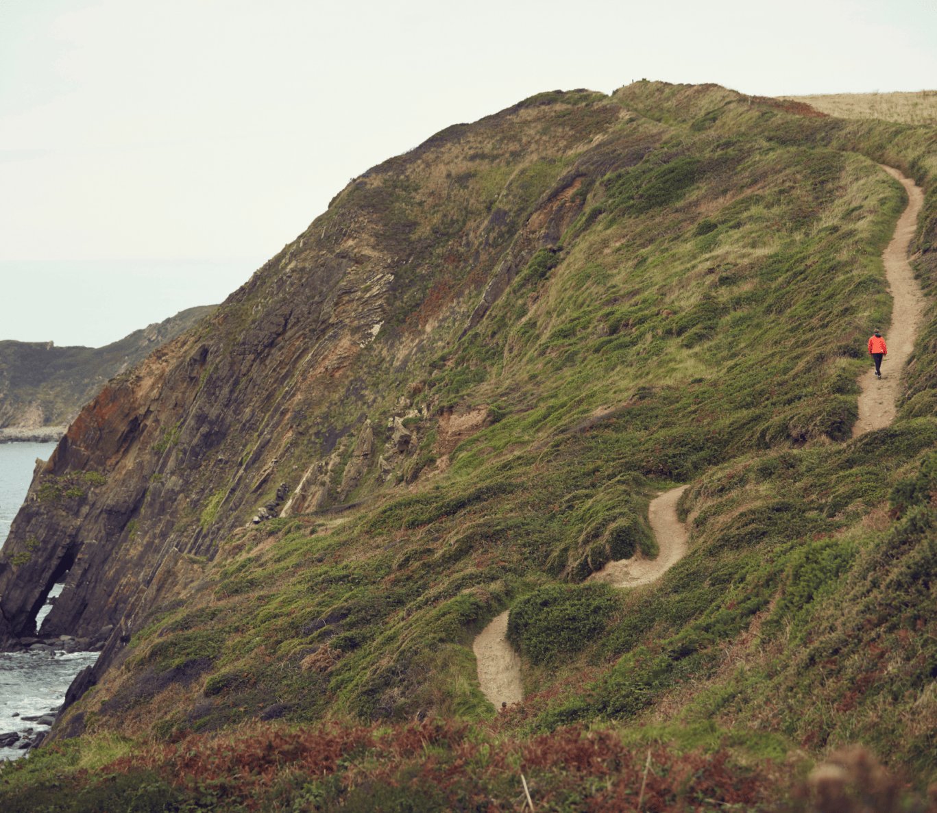 a person climbing a hill